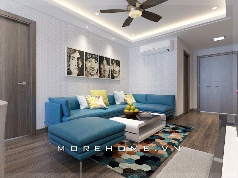 Bộ ghế sofa màu xanh đóng vai trò là điểm nhấn giúp không gian phòng khách trở nên thân thiện, ấn tượng hơn.